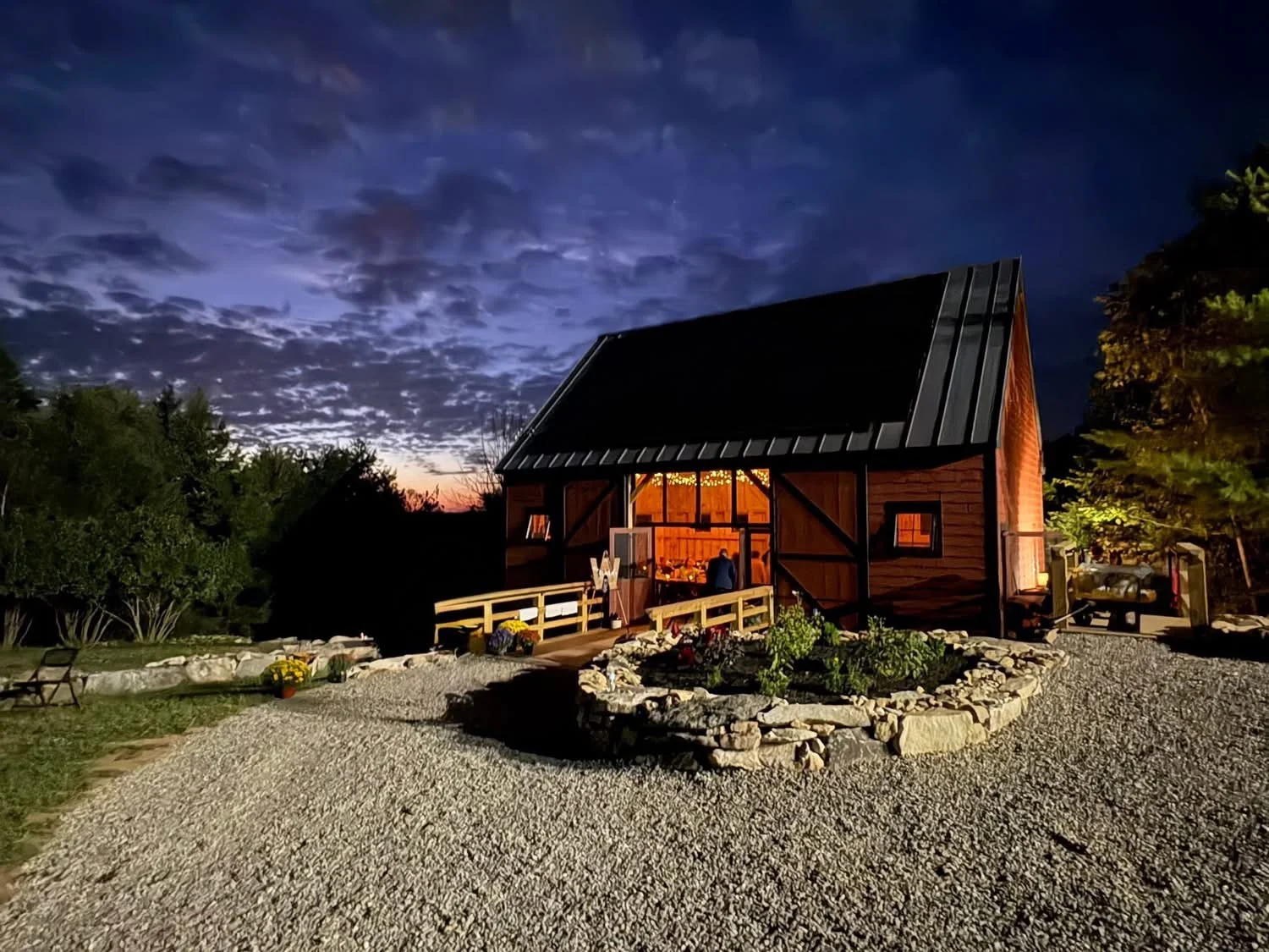 Authentic maine barn on the Land at night with beautiful night sky behind